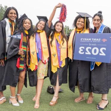 Graduating students standing together with a sign that says Saint Mary's College Class of 2023