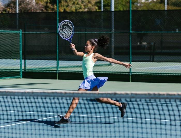 A girl playing tennis